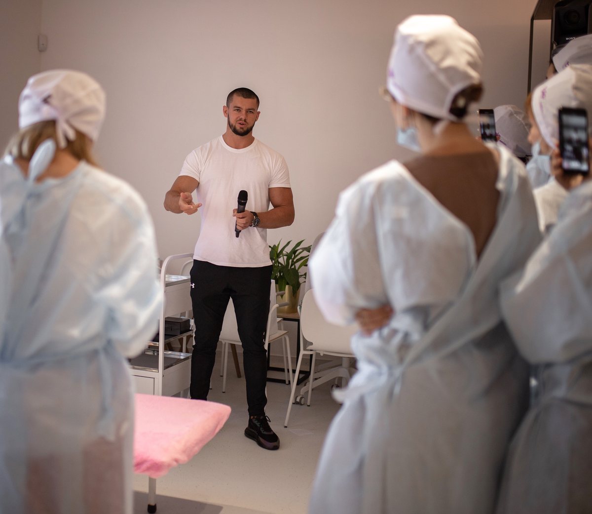 Founder speaking to a room of specialists, 2021